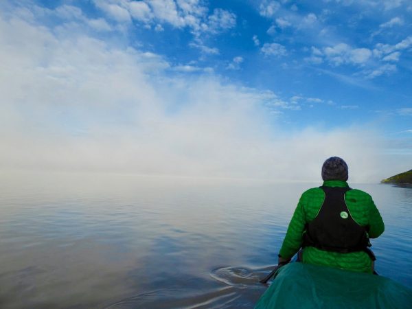 a foggy view from a canoe
