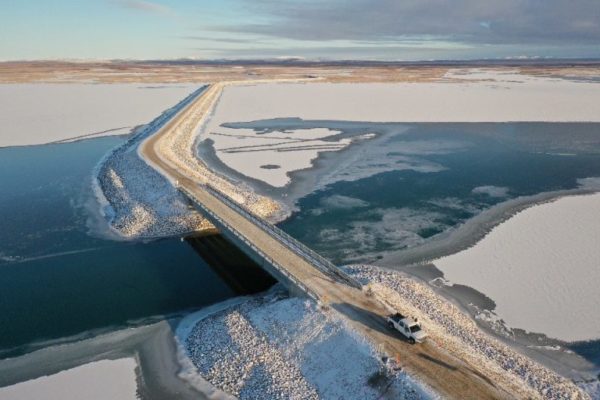 The new Kivalina Access Road stretches over an icy river in Alaska's Northwest Arctic.