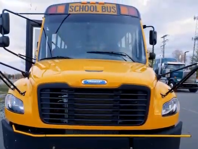 A front view of a yellow school bus