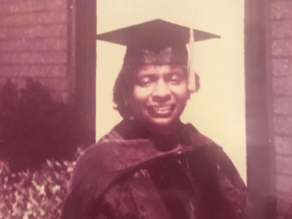 an old photo of a Black woman in a graduation gown