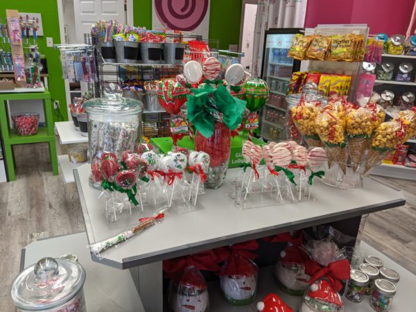 A shelf with handmade chocolates and candies themed for the holiday