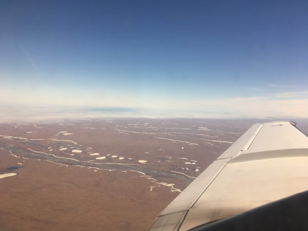 A view from an airplane of vast tundra.