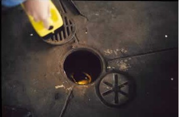 A floor drain with the lid removed