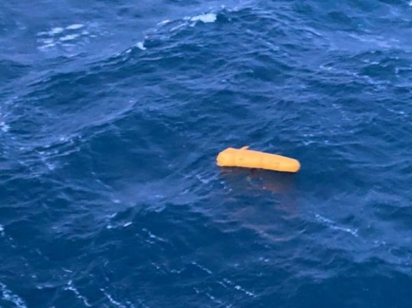 a yellow float in a blue ocean