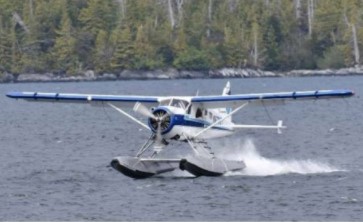 A float plane lands in the water