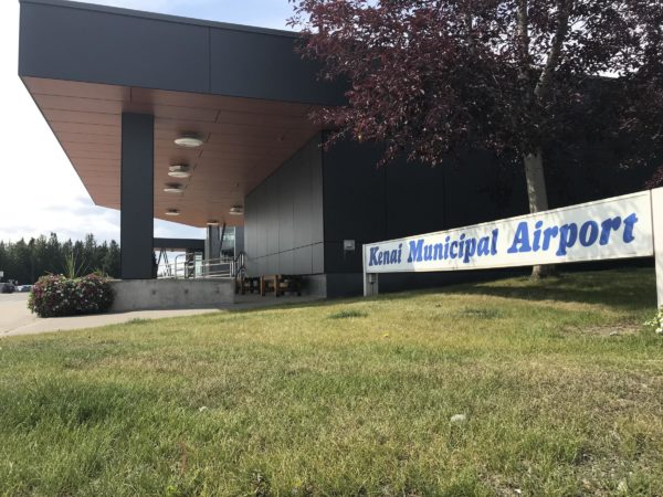 A building with a sign that says Kenai Municipal Airport