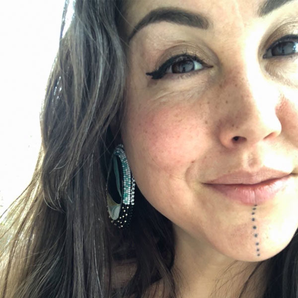 portrait of woman with traditional Alaska Native chin tattooing