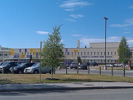 A parking lot of a high school 