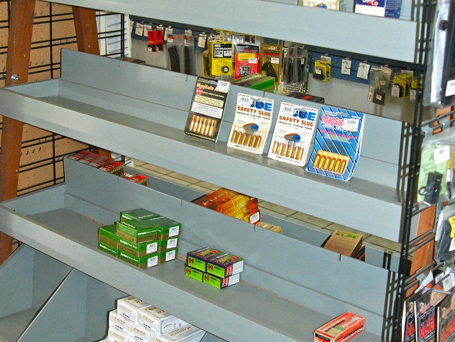 A shelf with a few bozes of ammo