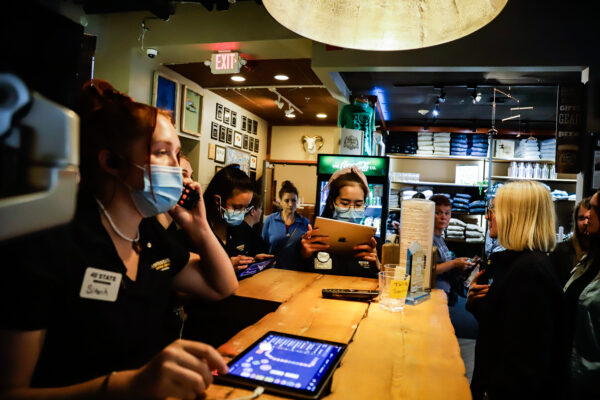 restaurant hosts answer phones and coordinate for diners to get seated