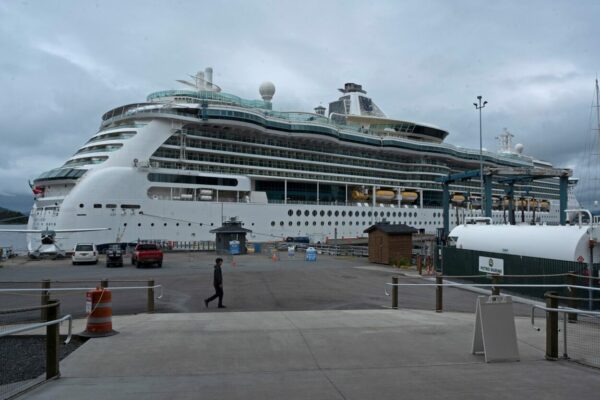 A white cruise ship on a dock