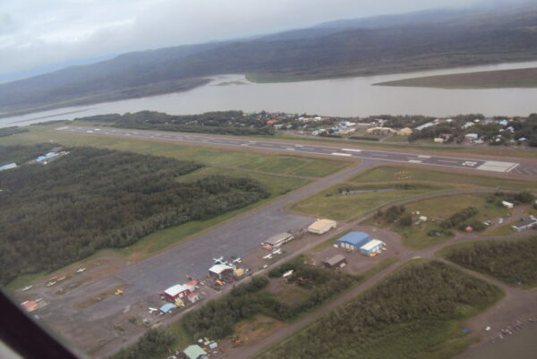 A small airport next to a river as seen from above