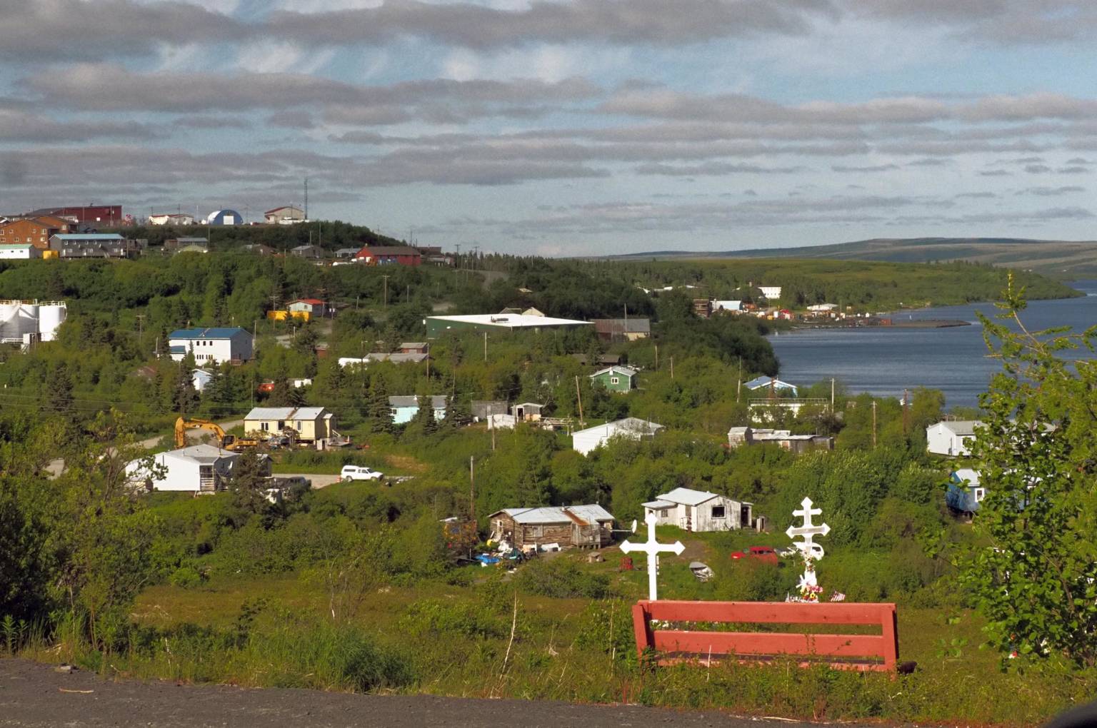 Collection of buildings connected a grassy hill