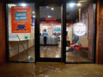 Floodwaters make their way into a Domino’s pizza restaurant caused by the remnants of Hurricane Ida drenching the New York City and New Jersey area on Wednesday in Hoboken, N.J.