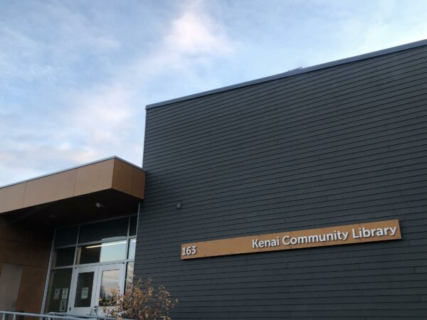 A building with a sign that says 163 Kenai Community Library.