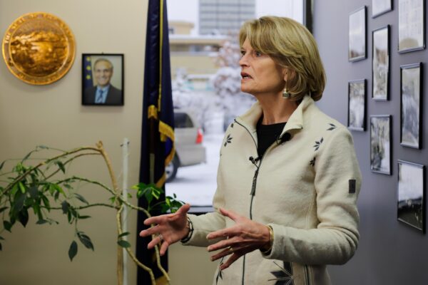 Sen. Lisa Murkowski speaks with reporters inside the Division of Election office in Anchorage