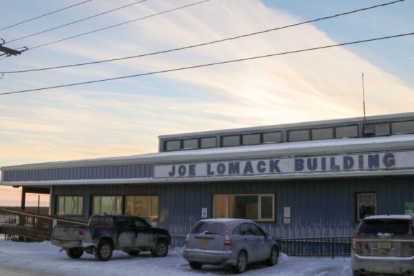 The outside of a building that says: Joe Lomack Building.