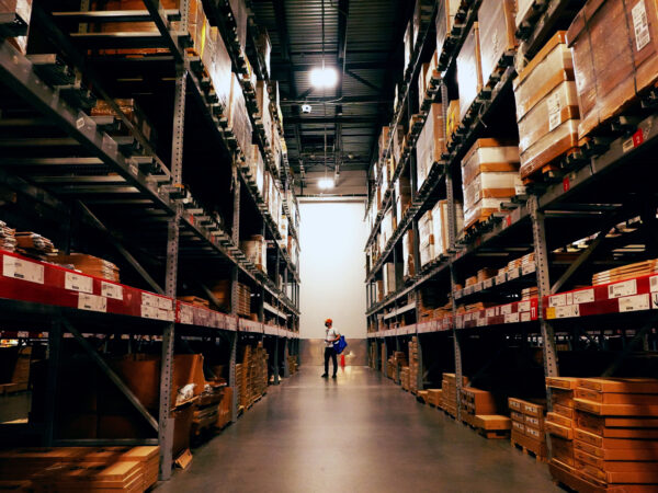 A person walks in an Ikea warehouse.