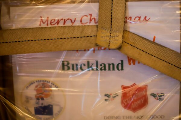 a present sits on a pallet. It reads "Merry Christmas, Buckland"
