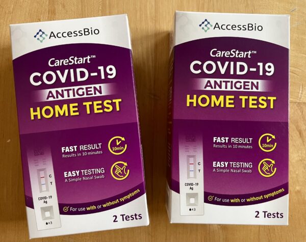 Two boxes of covid testing kits