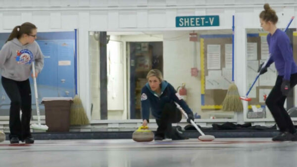 A woman curling.