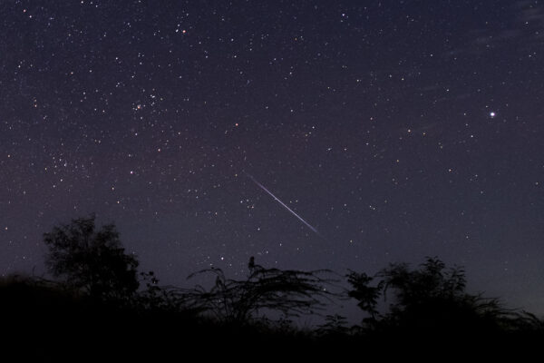 A meteor in a night sky.