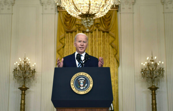 Biden speaks at a podium