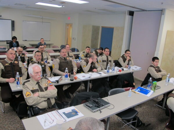 Officers sit in a meeting room