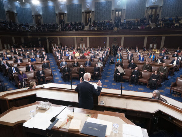 President Joe Biden, seen from above and behind, delivering the State of the Union address