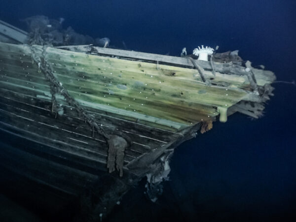 underwater photo of the bow of a wooden ship
