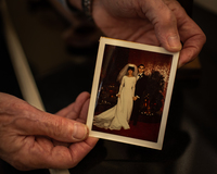 Hands holding a wedding photo