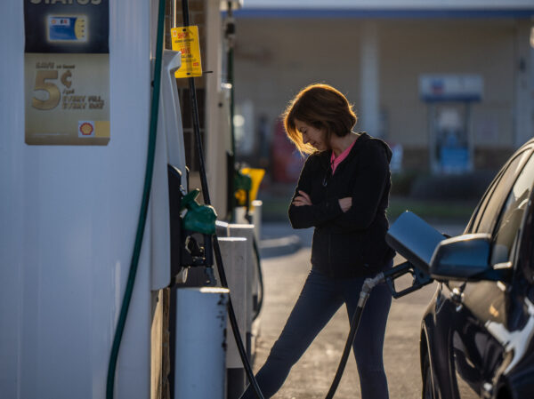 a person at a gas pump