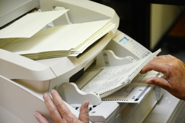 ballots go into a scanner