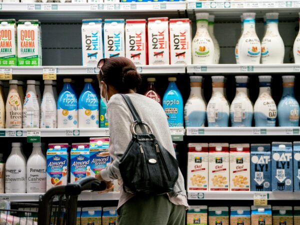 a woman looks at milk