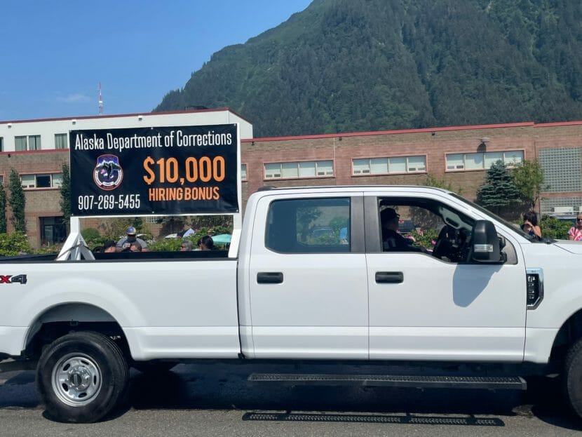 Exterior: a truck with an Alaska Department of Corrections banner