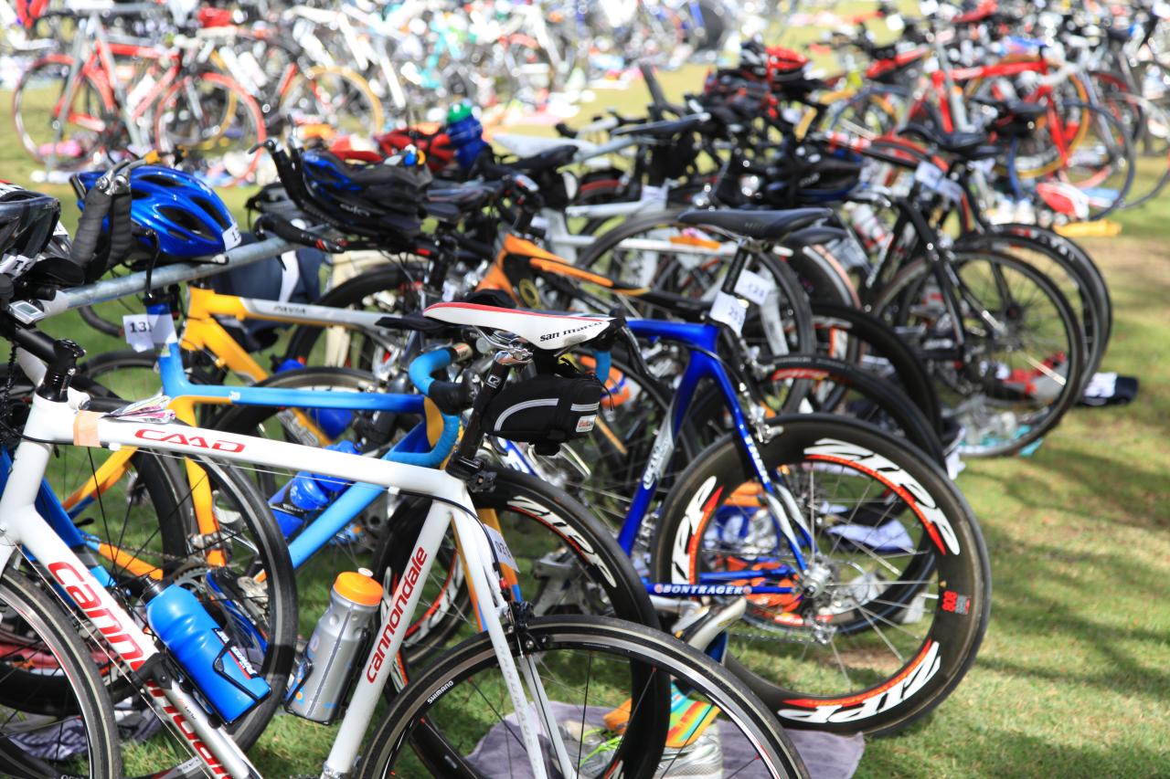 many bikes on a rack outside