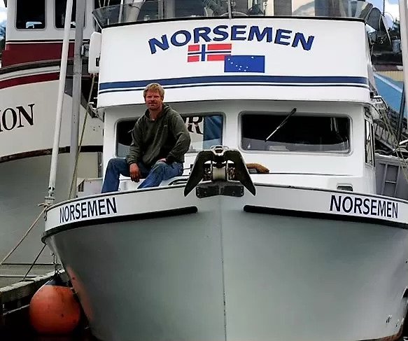 a man sits on a boat called Norseman