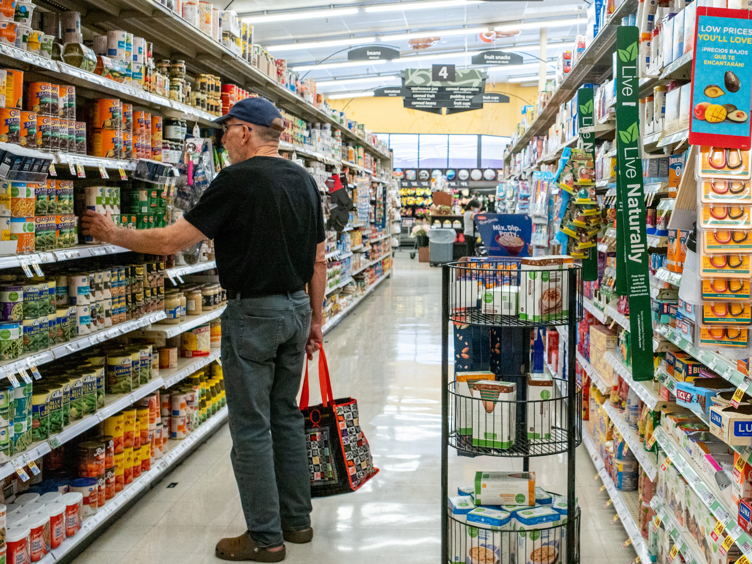 a man shopping in a crowded grocery store