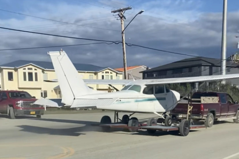 exterior: a plane being towed away after making an emergency landing