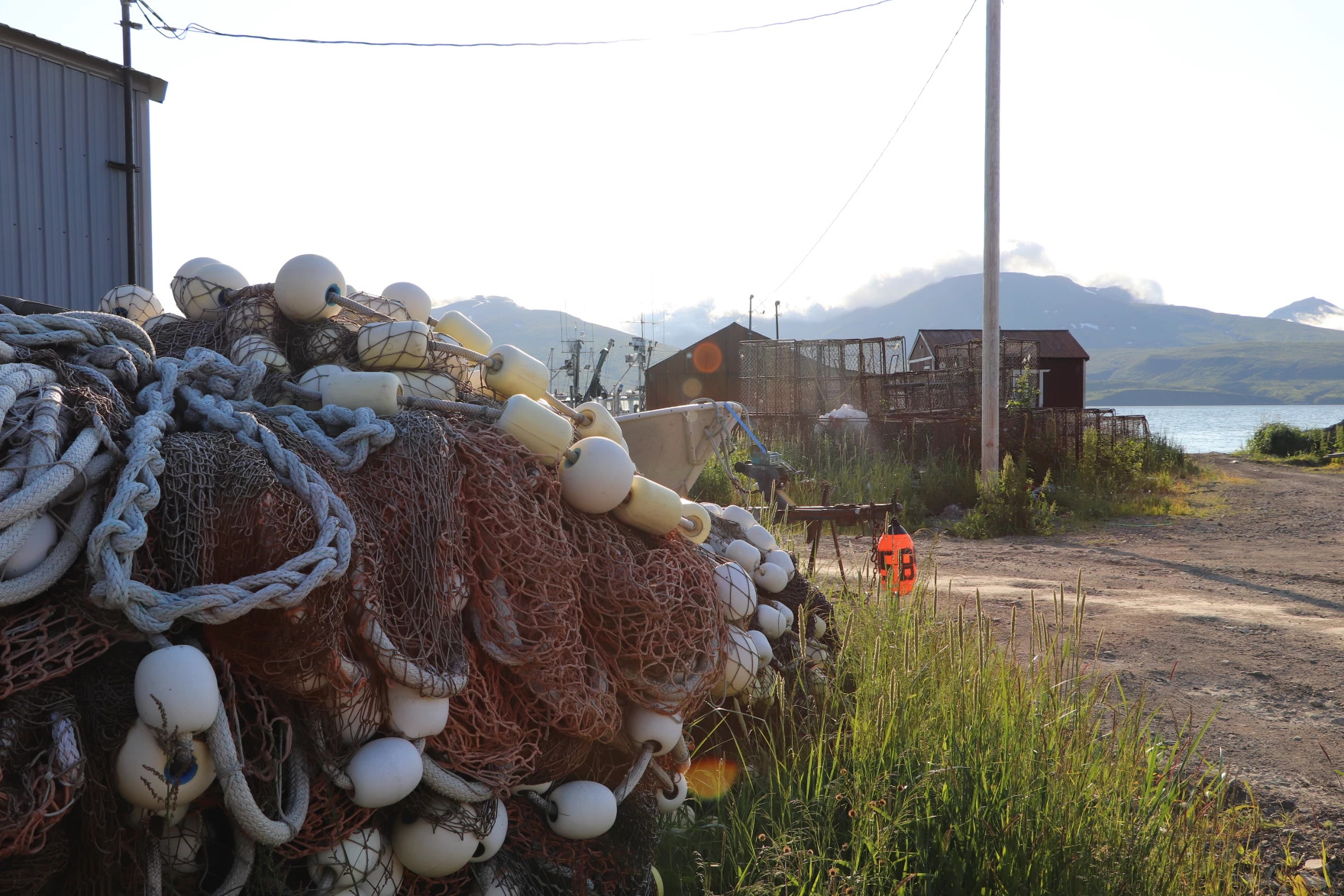Exterior: buoys and nets for fishing, piled on land