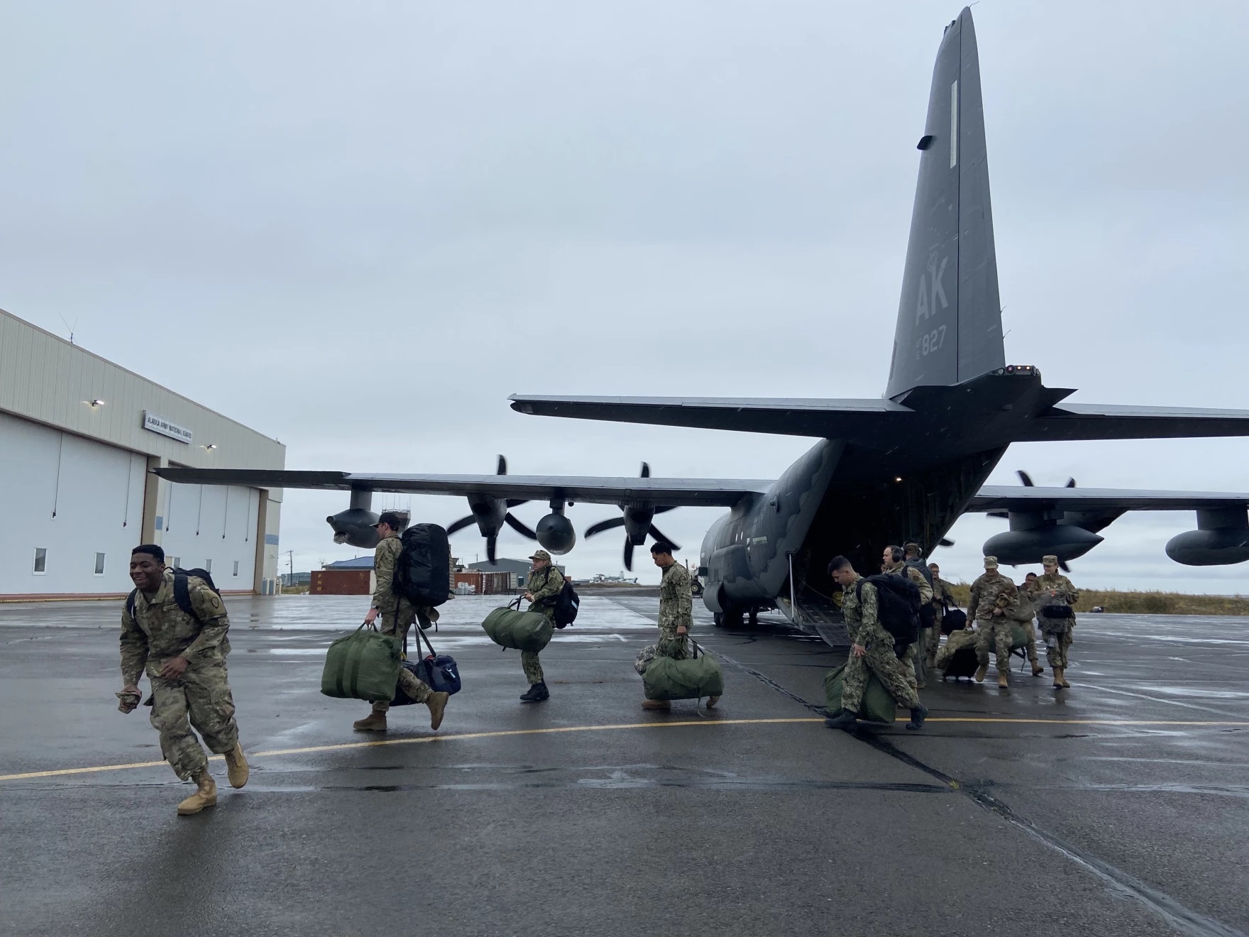 soldiers exiting a transport plane
