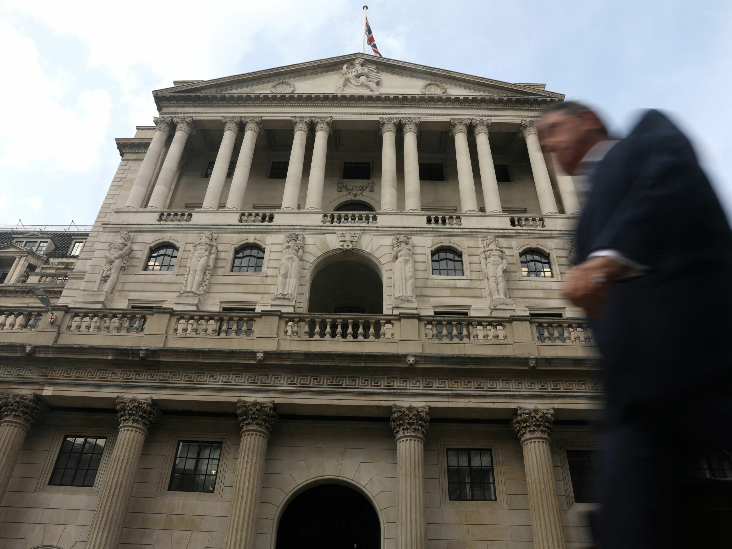 A pedestrian walks past Bank of England (BoE) in the City of London on September 22, 2022. - The Bank of England hiked its interest rate sharply again to combat decades-high inflation but warned the UK economy was slipping into recession. (Photo by Isabel INFANTES / AFP) (Photo by ISABEL INFANTES/AFP via Getty Images)