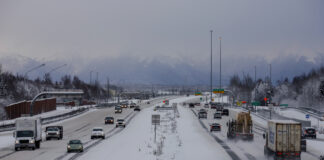 Cars on a highway with snow