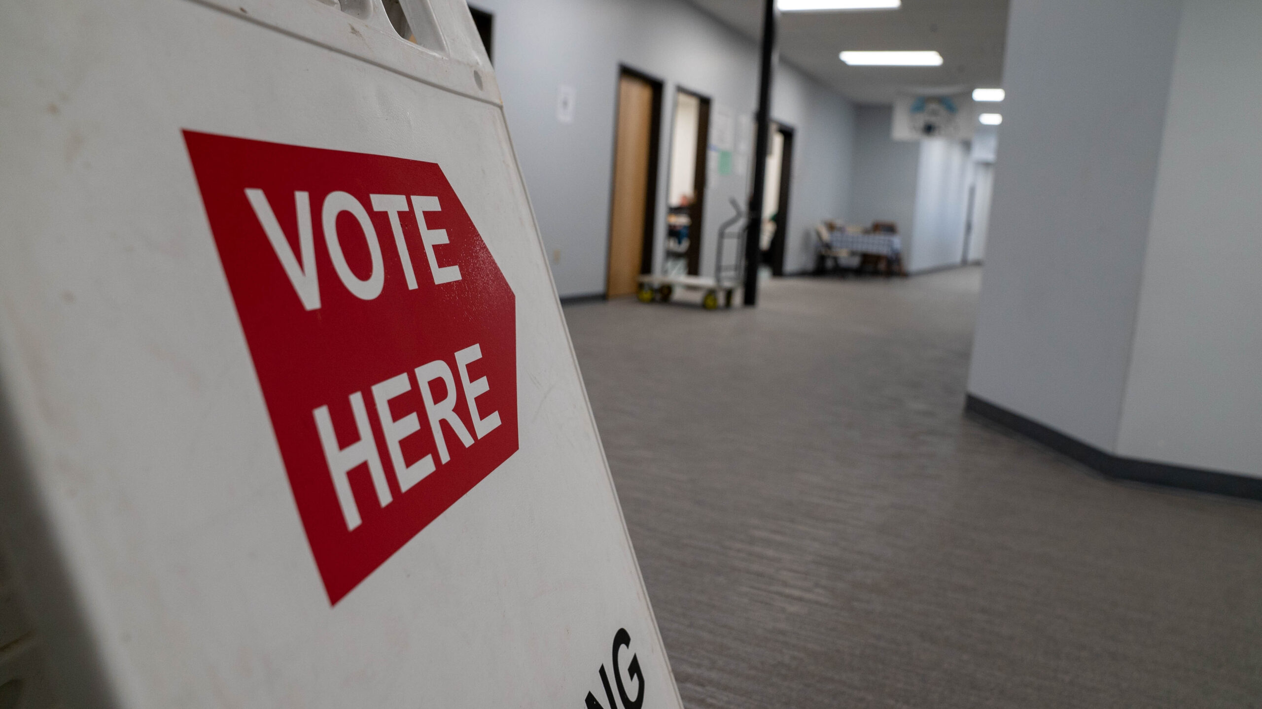 A "Vote here" sign inside a building