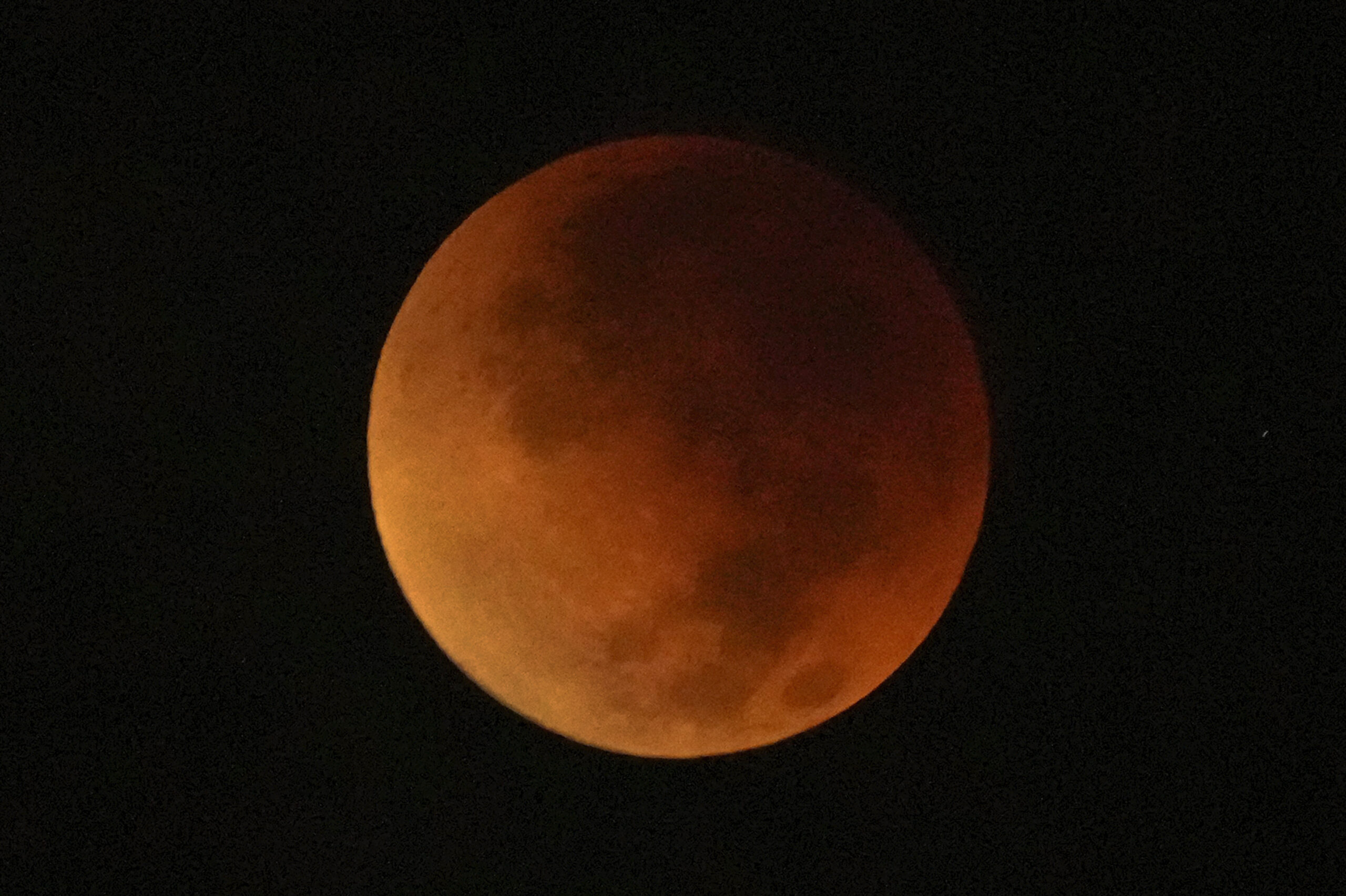 a reddish colored moon