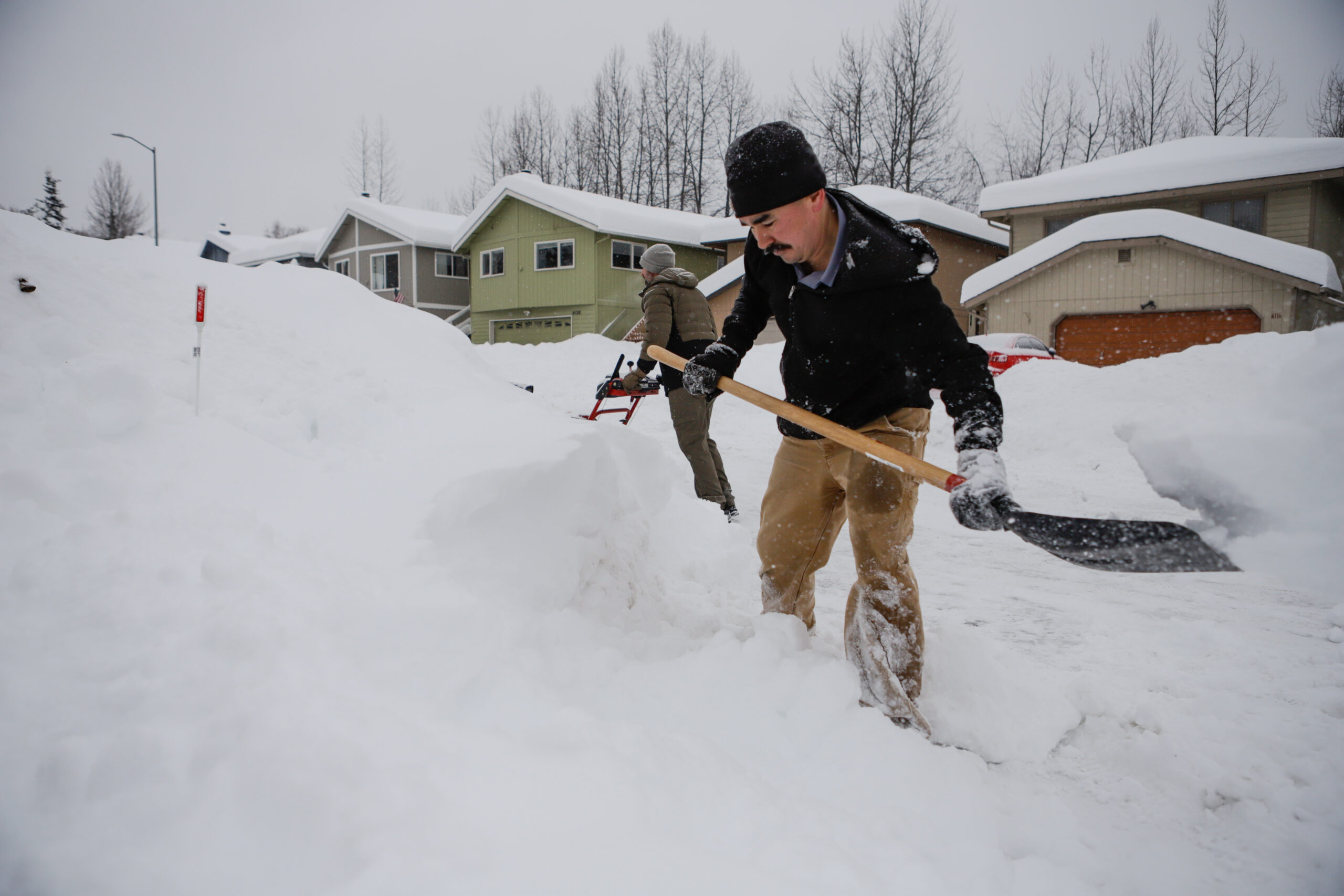 a man shovels snow