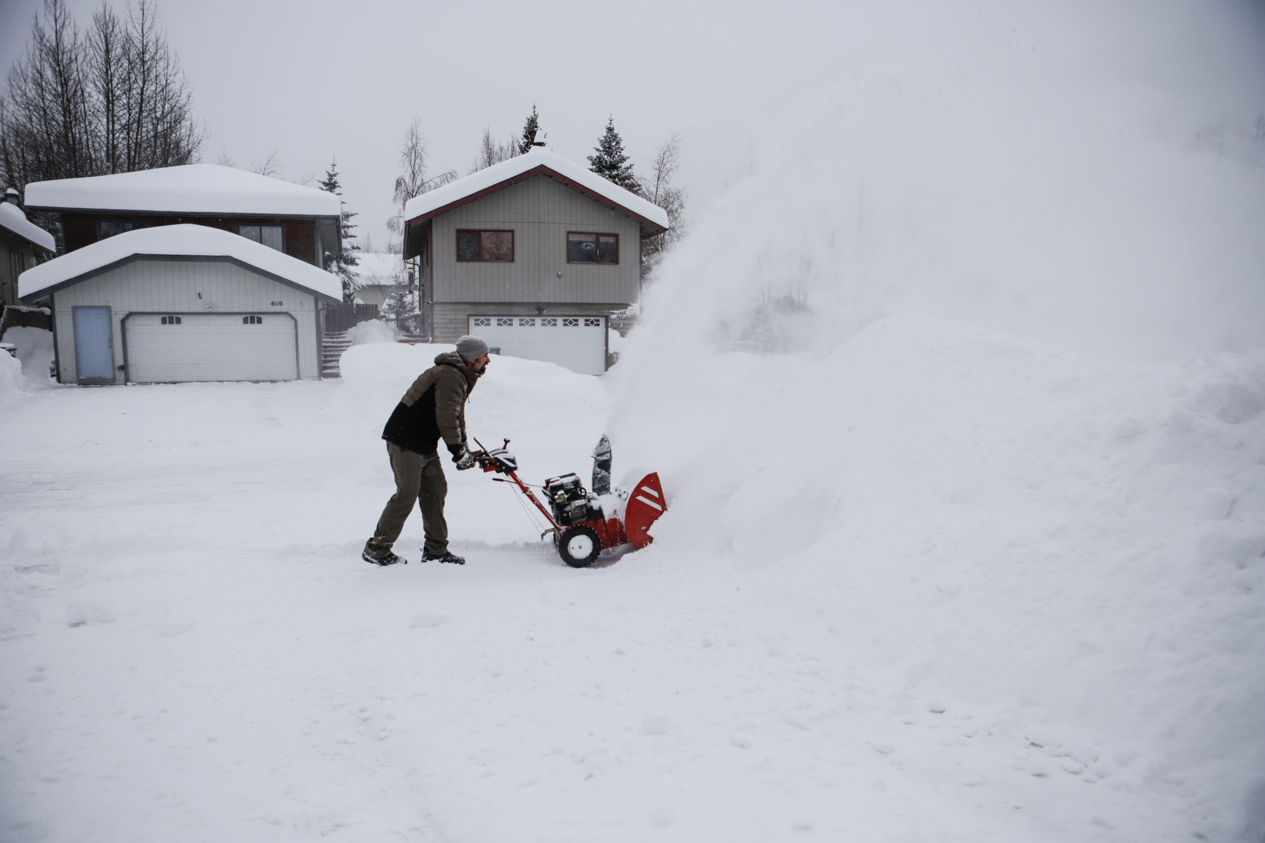 A man with a snow blower.