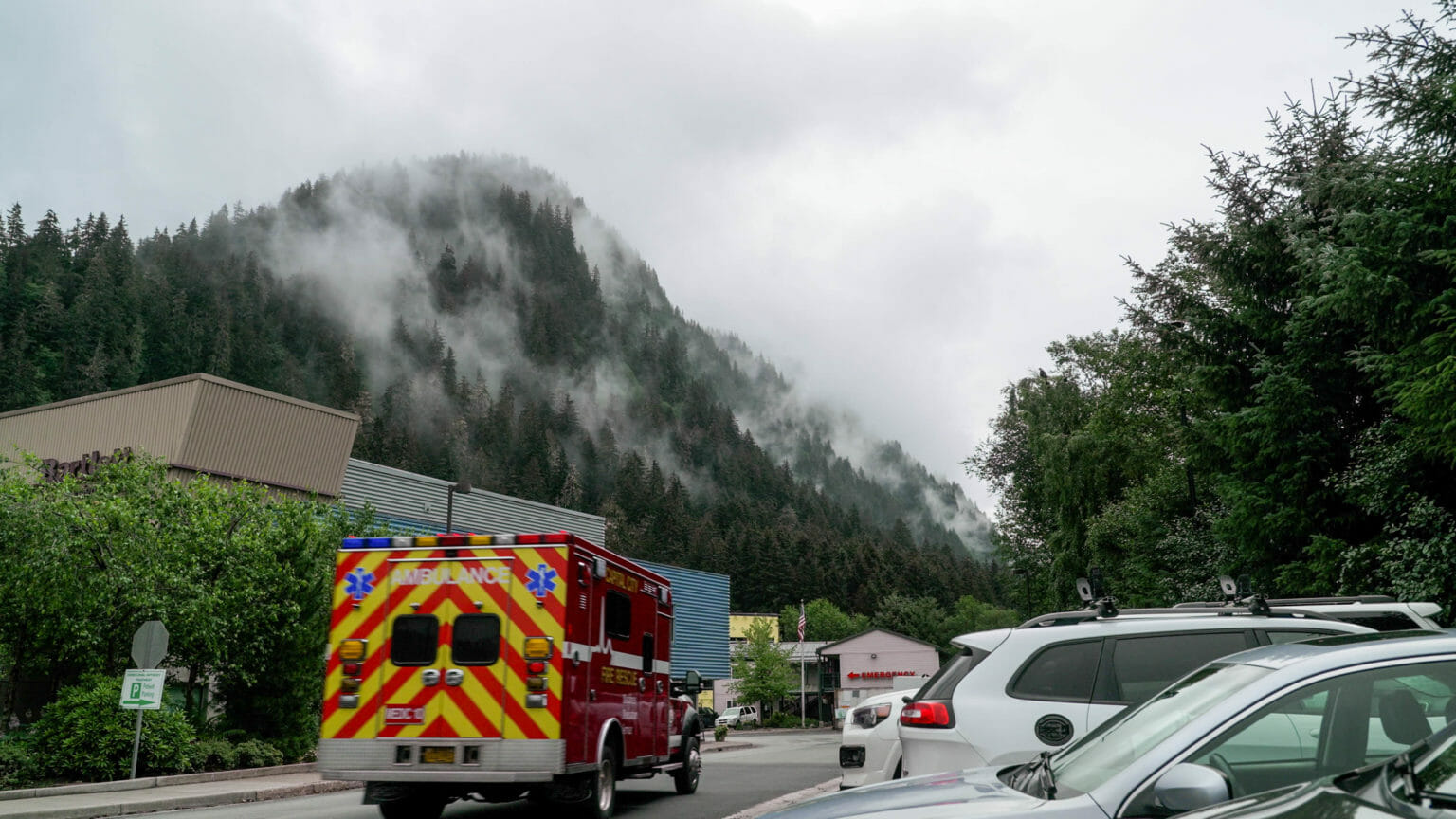 an ambulance with a mountain in the background