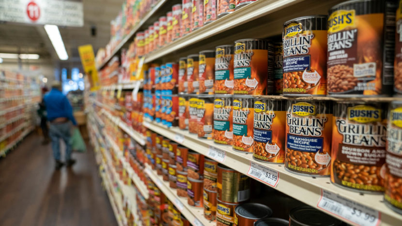 Canned goods on a grocery store shelf