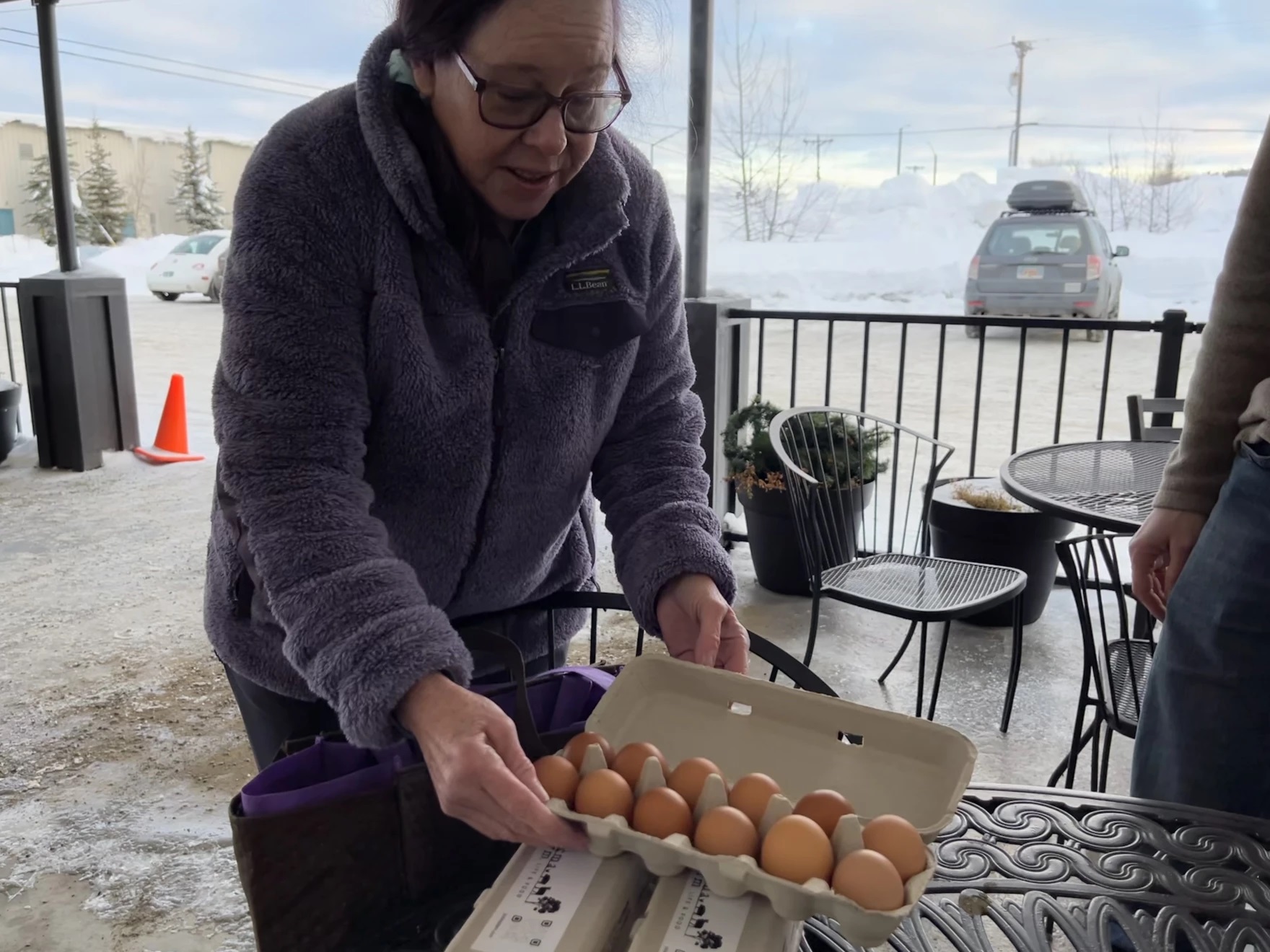 a woman with a dozen eggs